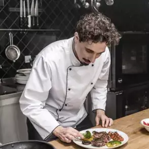 image of our lead chef cooking